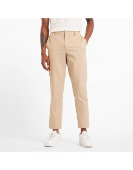 Мужские брюки New Balance MP43554SOT - бежевые