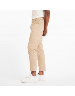 Мужские брюки New Balance MP43554SOT - бежевые