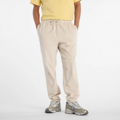 Мужские брюки New Balance MP53521TWF - бежевые
