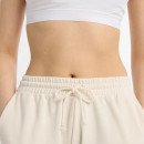 Женские брюки New Balance WP51503LIN - бежевые